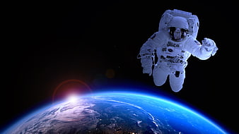Astronaut floating in space above Earth horizon