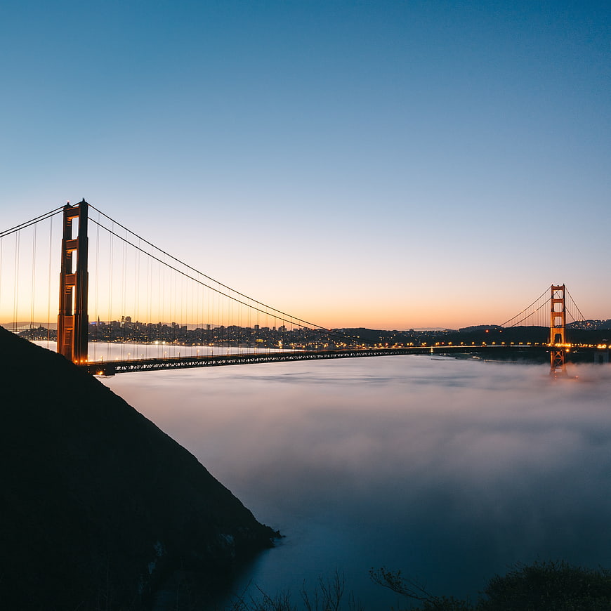 Golden Gate Bridge at Dusk with Fog and City Lights