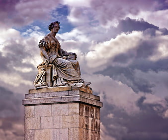 Abundantia Monument Statue in Paris Against Dramatic Clouds