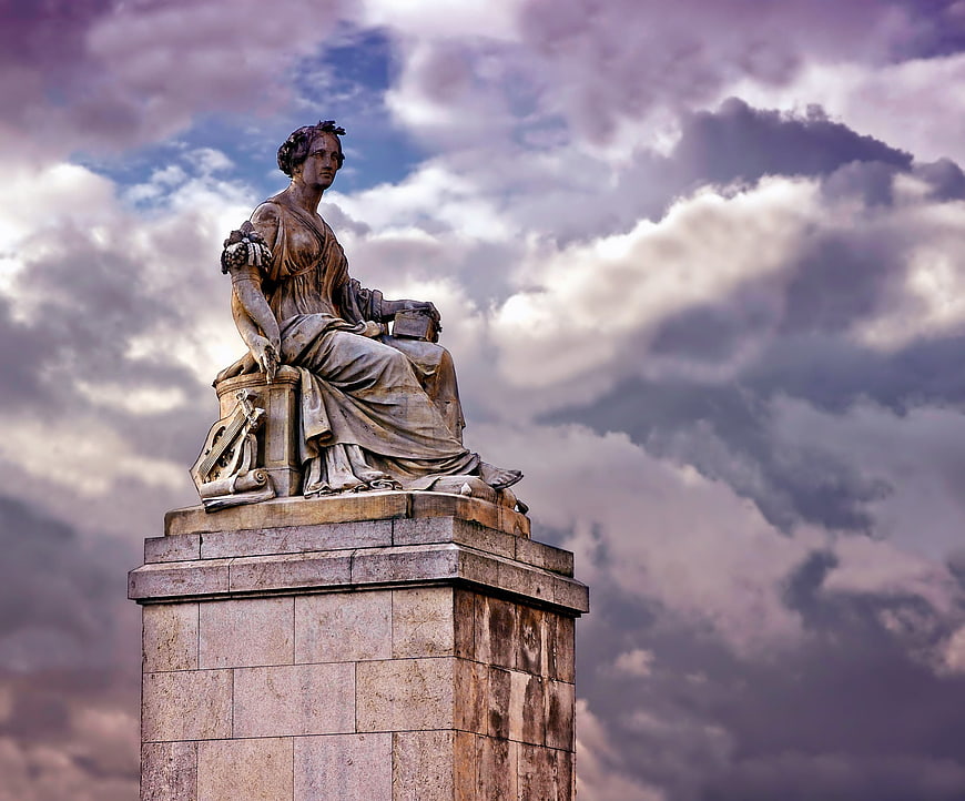 Abundantia Monument Statue in Paris Against Dramatic Clouds