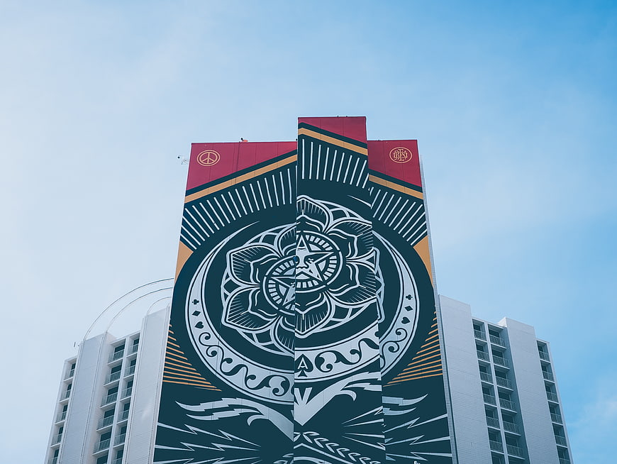 Low angle view of building with large mural art