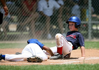 Young Baseball Player Sliding into Base