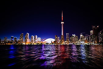 Toronto Skyline at Night with CN Tower and Water Reflections