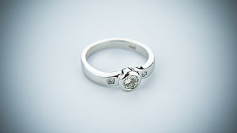 Silver diamond engagement ring on white background