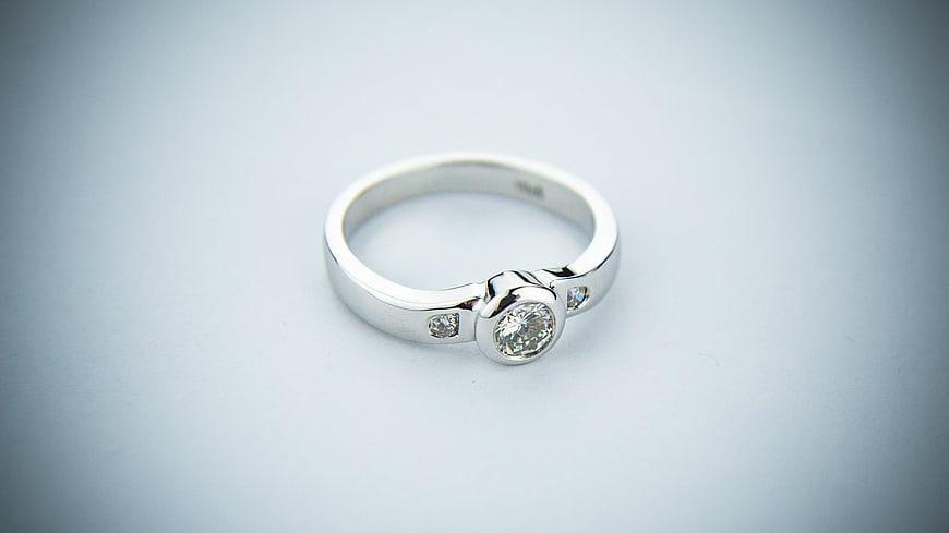 Silver diamond engagement ring on white background