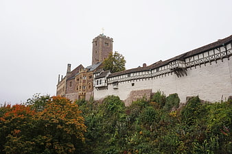 Wartburg Castle in Eisenach, Germany with autumn foliage