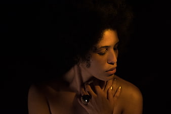 Moody Portrait of Woman with Afro and Gold Ring