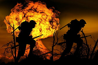 Silhouetted soldiers running through battlefield with massive explosion