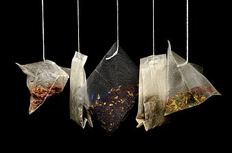 Hanging Herbal Tea Bags on Black Background