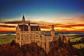 Neuschwanstein Castle at Sunset with Dramatic Sky