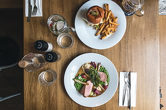 Top view of gourmet burger and pork tenderloin on wooden table
