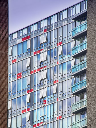 Modern Apartment Building Facade with Red and Blue Windows