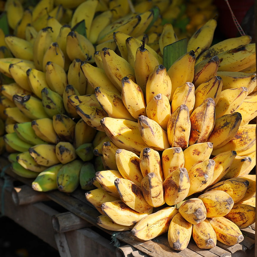 Fresh Yellow Bananas on Wooden Market Stall