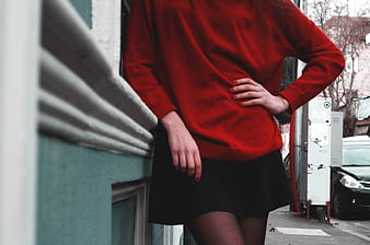 Woman in Red Sweater and Black Skirt Street Style