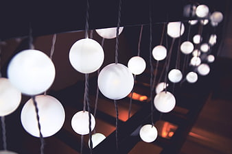 Modern Hanging Globe Lights on Black Staircase