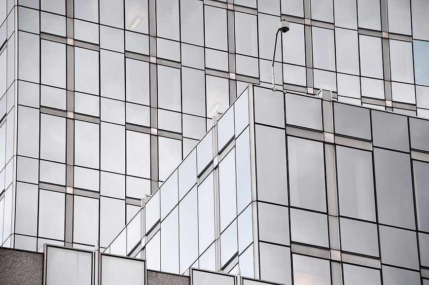 Modern Glass Building Facade With Geometric Grid Pattern