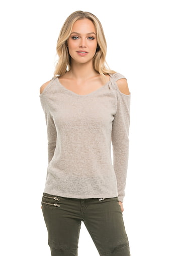 Blonde Woman in Beige Cold Shoulder Top and Green Pants