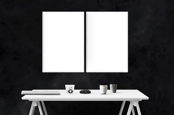 Minimalist White Desk with Dual Poster Frames on Black Wall