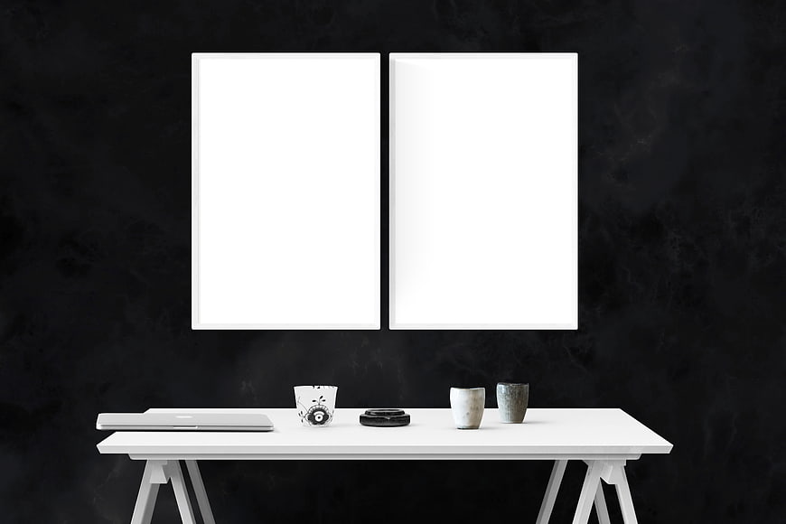 Minimalist White Desk with Dual Poster Frames on Black Wall