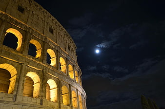 Colosseum at Night with Moon and Clouds