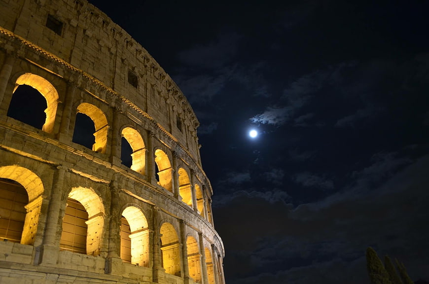 Colosseum at Night with Moon and Clouds