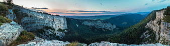 Panoramic View of Creux du Van Cliff at Sunset