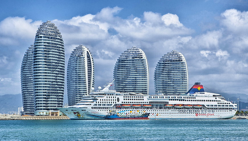 Cruise ship docked at Phoenix Island Sanya China skyline