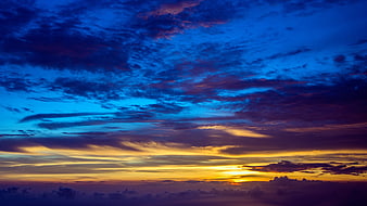 Dramatic Sunset Sky with Vibrant Blue and Golden Clouds
