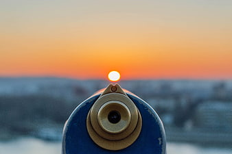 Blue Coin-Operated Telescope View of Orange Sunset