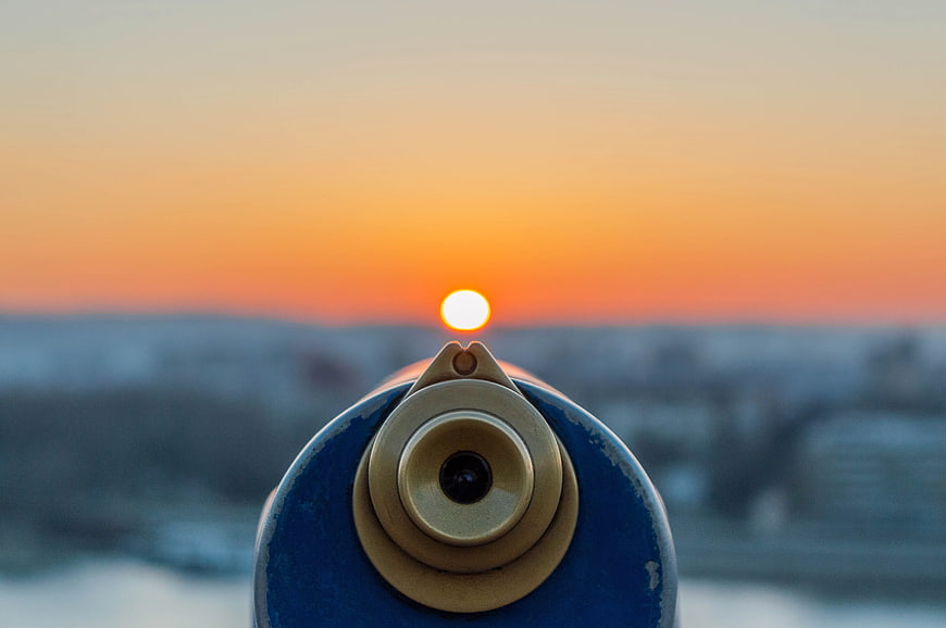 Blue Coin-Operated Telescope View of Orange Sunset