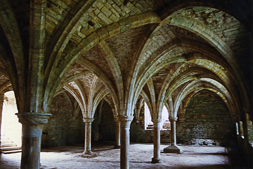 Gothic vaulted ceiling and stone columns in Battle Abbey ruins