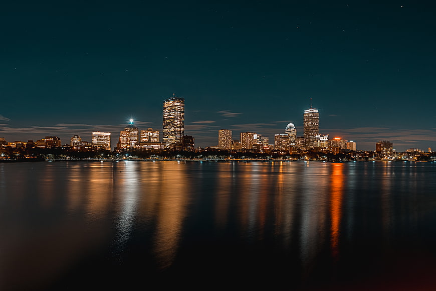 Boston Skyline at Night with Water Reflections