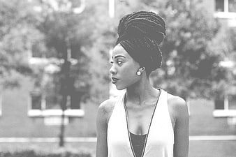 Black and white portrait of stylish woman with braided updo