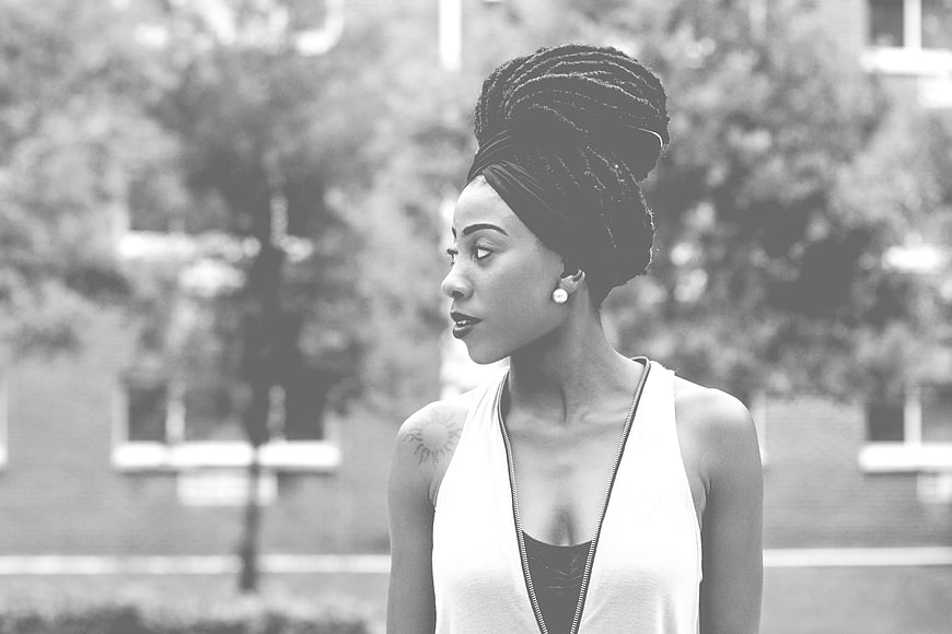 Black and white portrait of stylish woman with braided updo