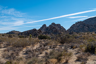 Desert landscape with rocky mountains and blue sky