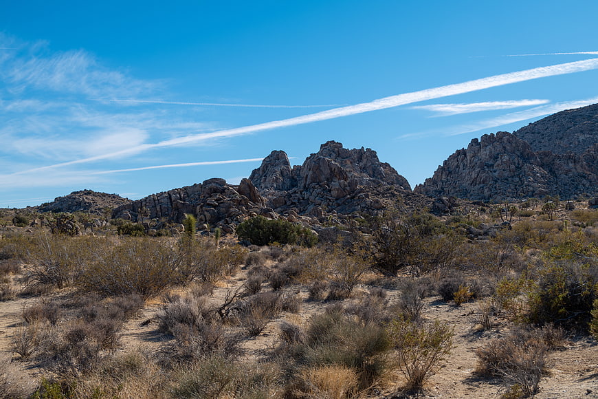 Desert landscape with rocky mountains and blue sky