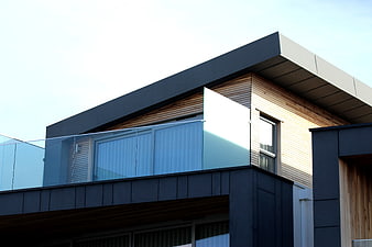 Modern House Architecture with Wood Cladding and Glass Balcony