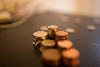 Stacks of Euro Coins on Dark Surface