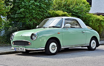 Mint Green Nissan Figaro Classic Car Parked On Street