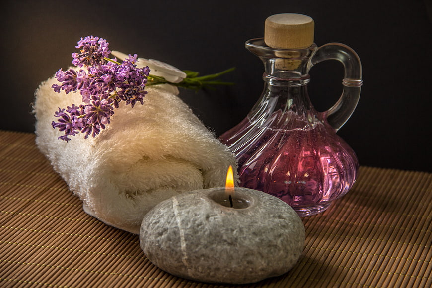 Spa Wellness Still Life With Lavender, Candle, And Oil Carafe