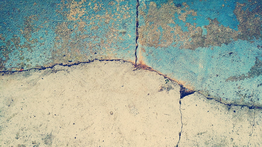Textured Blue and Beige Cracked Concrete Wall Background