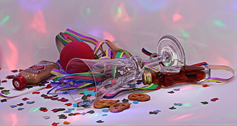 Post-Party Scene with Broken Glass, Confetti, and Pretzels