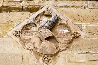 Carved Stone Coat of Arms on Historic Monastery Wall