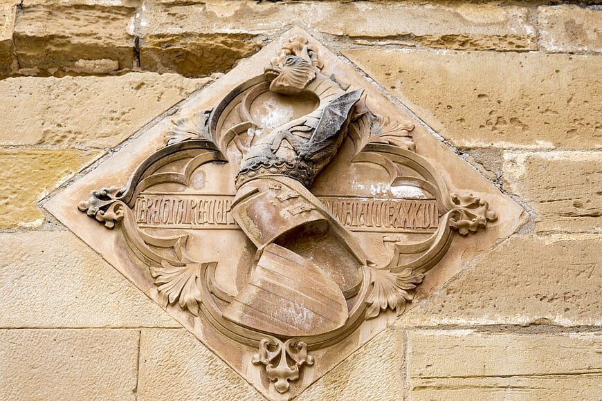 Carved Stone Coat of Arms on Historic Monastery Wall