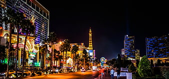 Las Vegas Strip Night View With Eiffel Tower Replica And Neon Lights