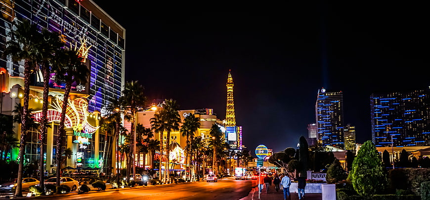 Las Vegas Strip Night View With Eiffel Tower Replica And Neon Lights