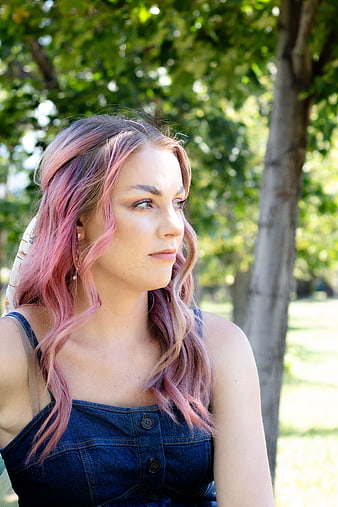 Portrait of Woman with Pink Hair in Park