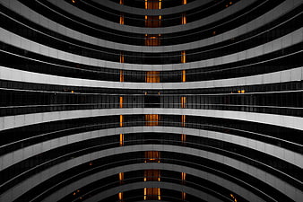 Abstract Curved Architecture with Warm Interior Lights