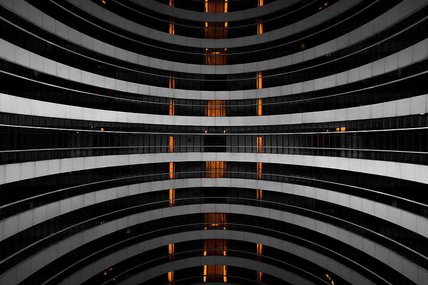 Abstract Curved Architecture with Warm Interior Lights