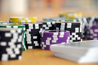 Stacks of Poker Chips and Playing Cards on Table